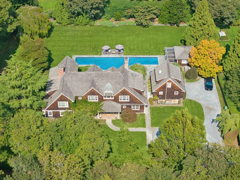 Aerial of the gated entry and driveway at 2 Borden Lane, East Hampton — photo 2 of 12