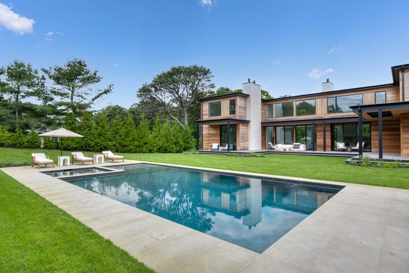 Pool terrace and rear of house at 204 Head of Pond Road, Water Mill — photo 9 of 10