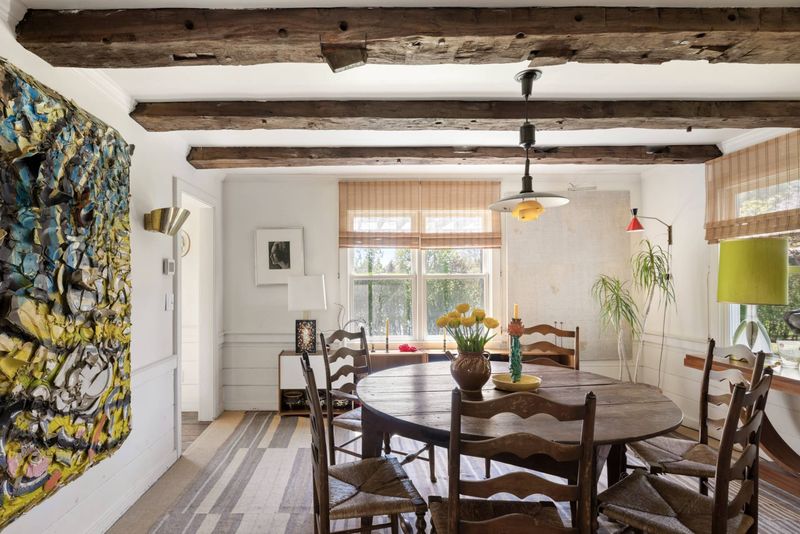 Dining room under exposed beams at 216 Sagaponack Road, Bridgehampton — photo 6 of 12