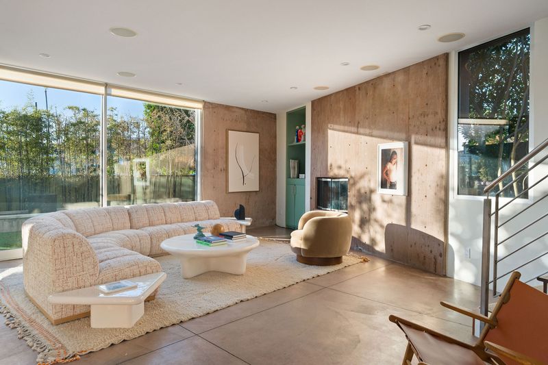 Sunlit living room with walls of glass at 2324 Boone Avenue, Venice — photo 2 of 8