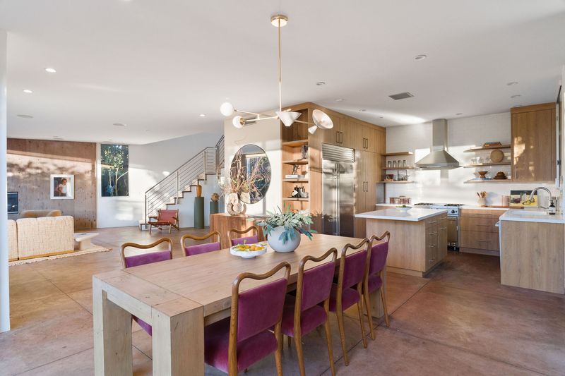 The chef's kitchen flowing into the dining area at 2324 Boone Avenue, Venice — photo 3 of 8