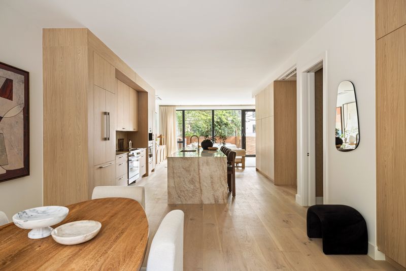 Kitchen and dining toward the rear glass at 235 Sackett Street #1, Carroll Gardens — photo 2 of 12