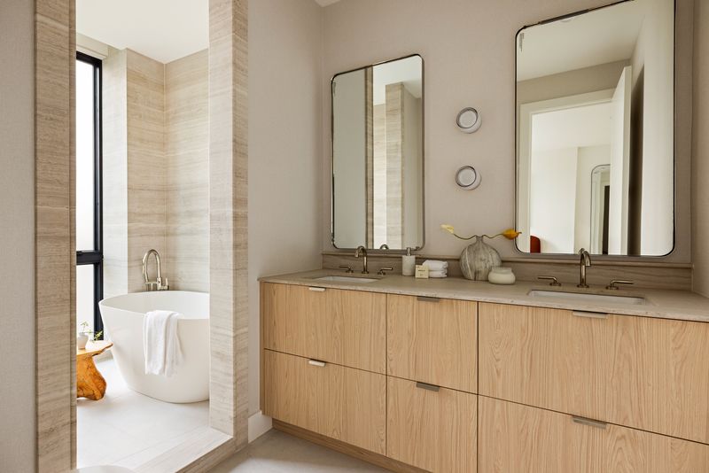 Primary bath with double vanity and soaking tub at 235 Sackett Street #1, Carroll Gardens — photo 7 of 12