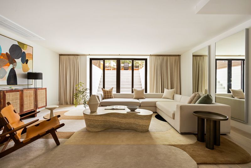 Lower-level family room with floor-to-ceiling glass at 235 Sackett Street #1, Carroll Gardens — photo 8 of 12