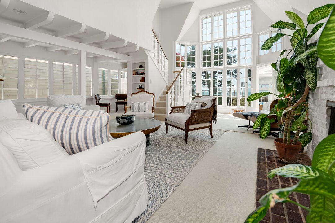 living room with two-story windows at 23708 Malibu Colony Road