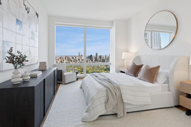 Second bedroom with park and skyline view at 25 Columbus Circle 57B, Columbus Circle — photo 7 of 8