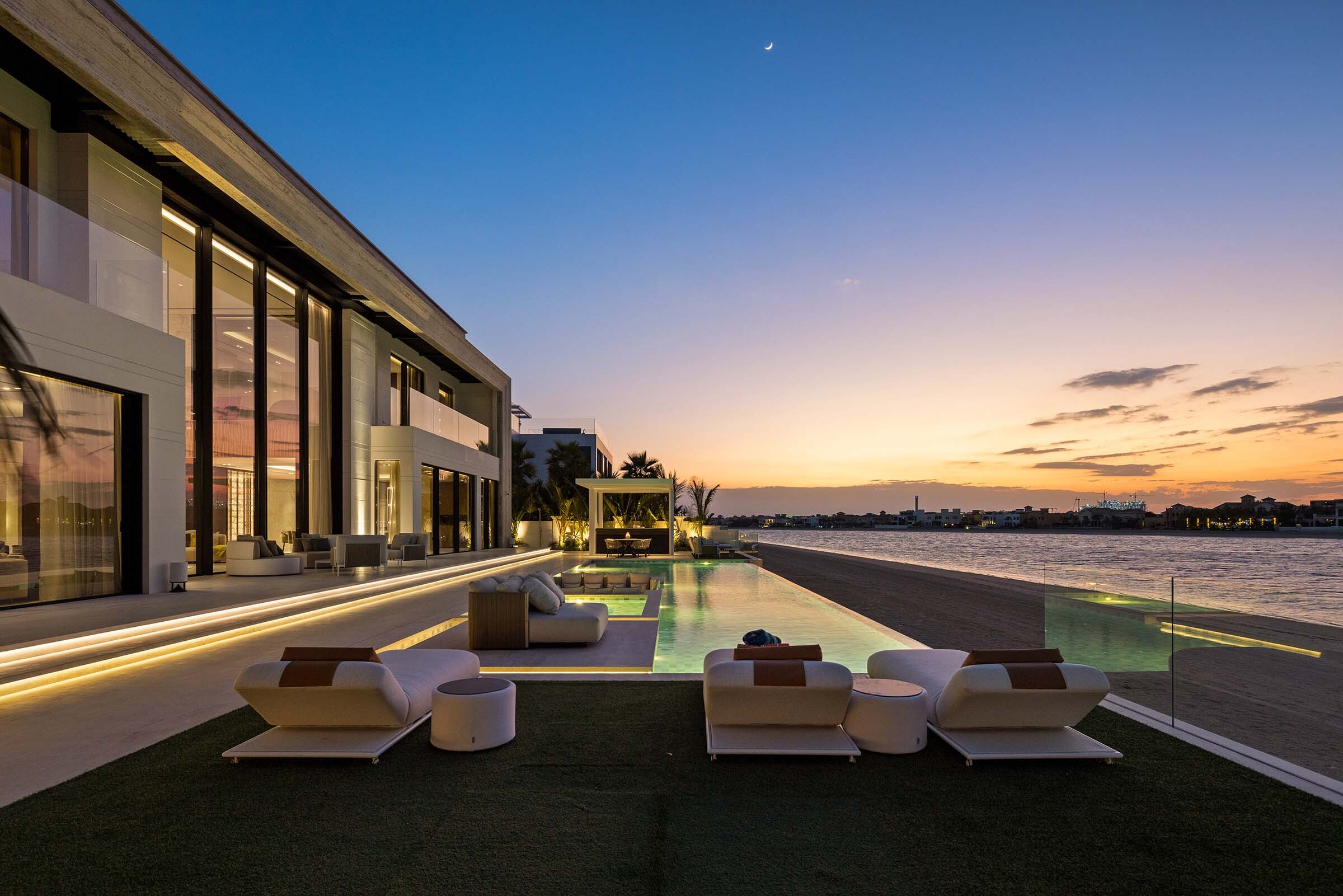 dusk pool deck at the 25 Degrees Signature Villa