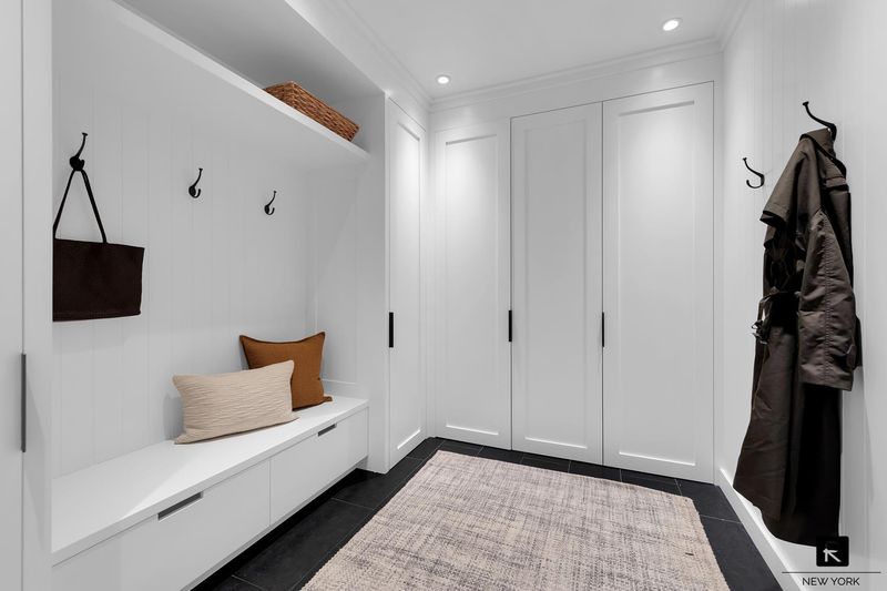 Custom mudroom with built-in bench and storage at 250 West Street 9JK, Tribeca — photo 10 of 12