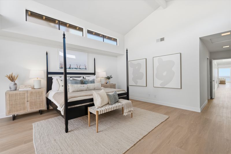 Primary bedroom with four-poster bed at 2516 The Strand, Manhattan Beach — photo 4 of 8