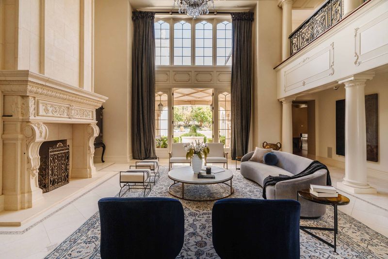 Formal living room with garden windows at 25242 Prado Del Misterio, Calabasas — photo 5 of 8