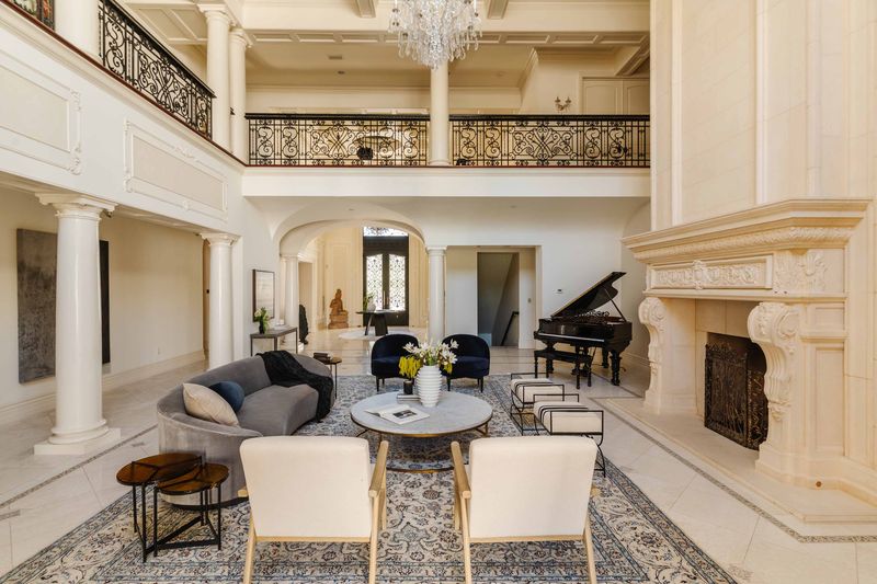 Grand staircase and open living volume at 25242 Prado Del Misterio, Calabasas — photo 6 of 8