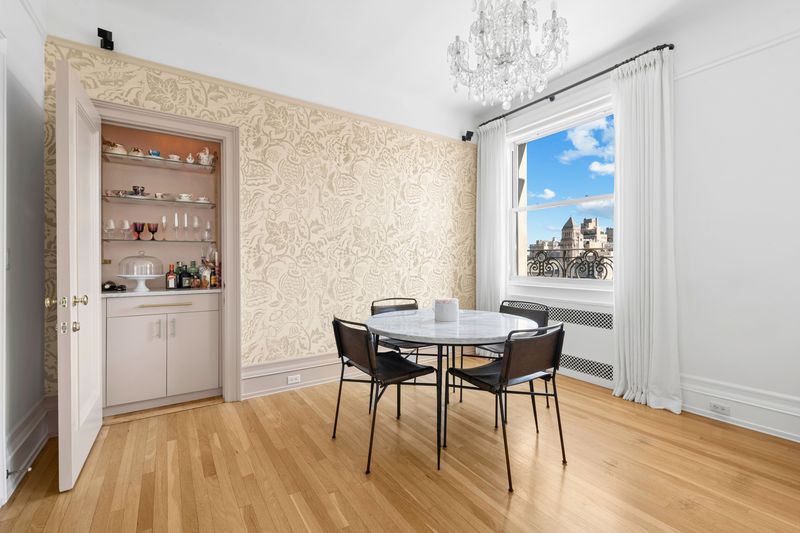 Dining area and bar at 26 East 63rd Street 11F, Upper East Side — photo 3 of 9