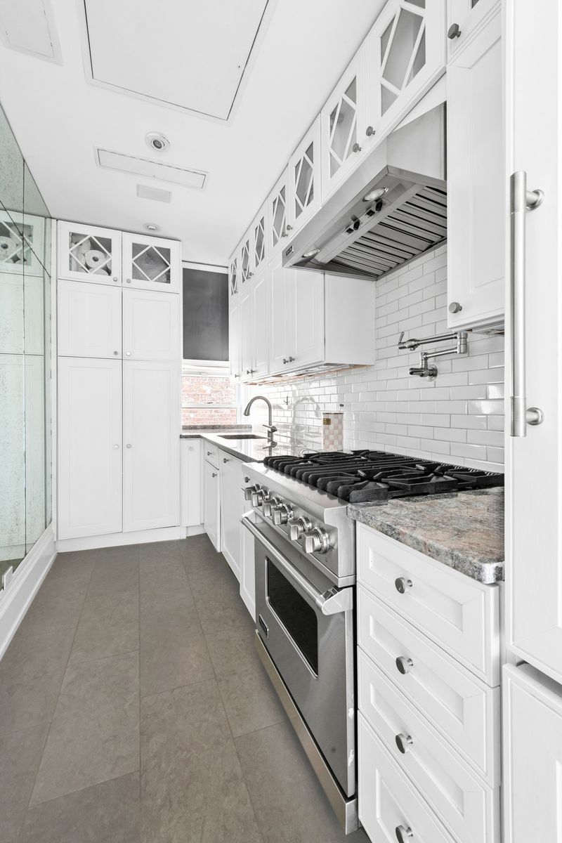 Renovated windowed kitchen at 26 East 63rd Street 11F, Upper East Side — photo 4 of 9