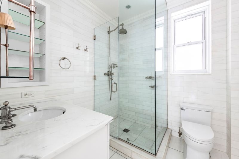 Windowed marble bath at 26 East 63rd Street 11F, Upper East Side — photo 7 of 9