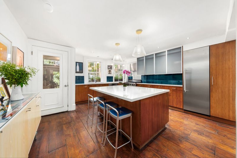 Eat-in kitchen with island at 264 West 12th Street, West Village — photo 4 of 9