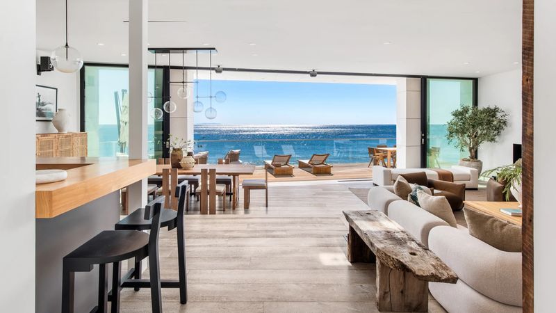 Open living and kitchen to ocean terrace at 26814 Malibu Cove Colony Drive, Malibu — photo 3 of 10