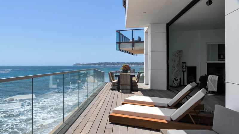 Glass-railed terrace over the Pacific at 26814 Malibu Cove Colony Drive, Malibu — photo 4 of 10