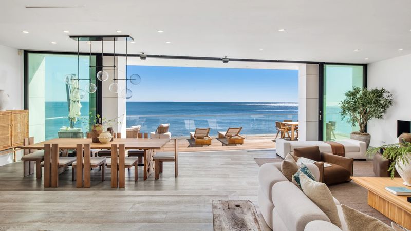 Dining and living, sliders open at 26814 Malibu Cove Colony Drive, Malibu — photo 5 of 10
