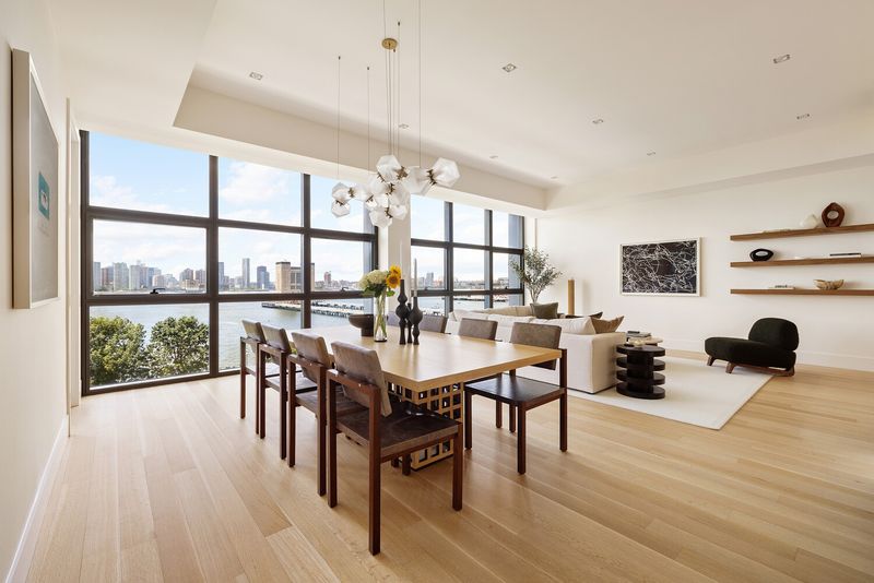 Dining area and great room with western river views at 290 West Street 5B, Tribeca — photo 6 of 12