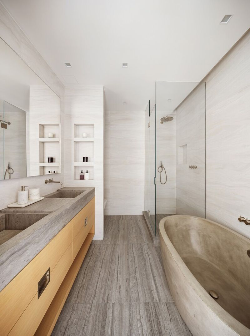 Primary bath with soaking tub and marble double vanity at 290 West Street 5B, Tribeca — photo 8 of 12
