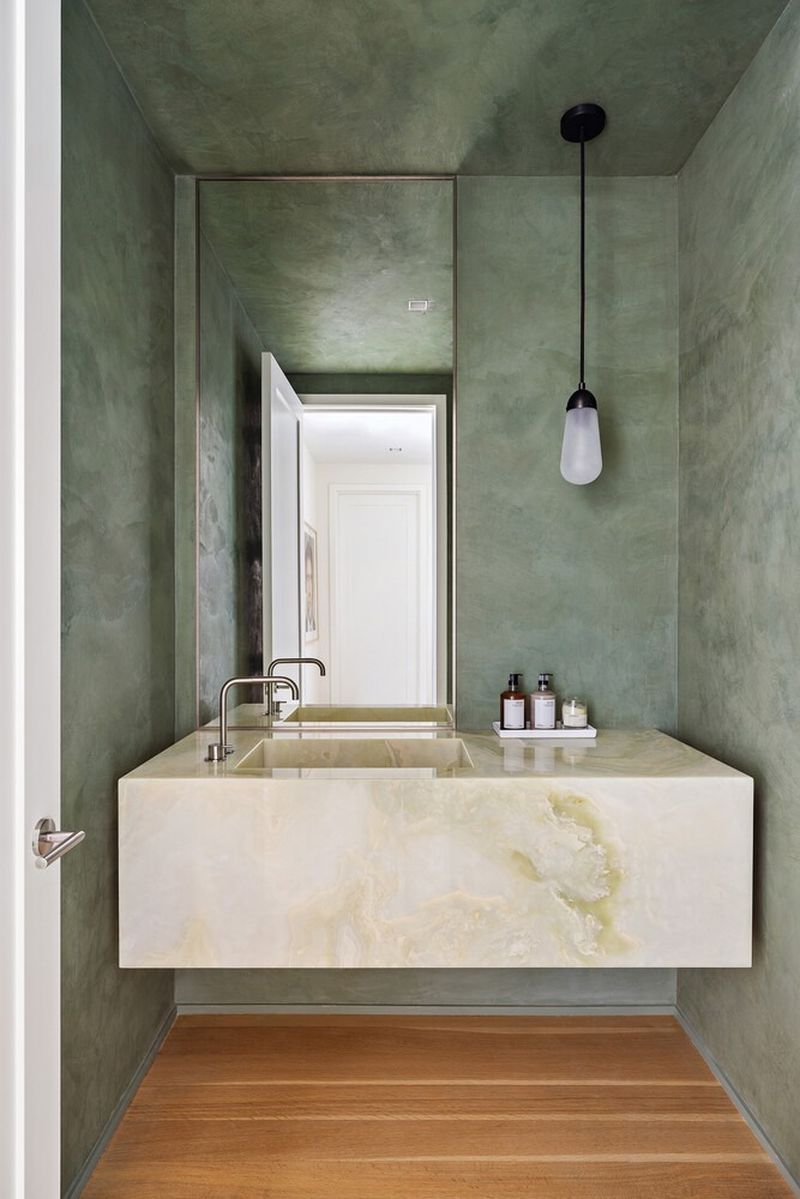 Powder room with a floating green onyx vanity and Tadelakt plaster walls at 290 West Street 5B, Tribeca — photo 10 of 12