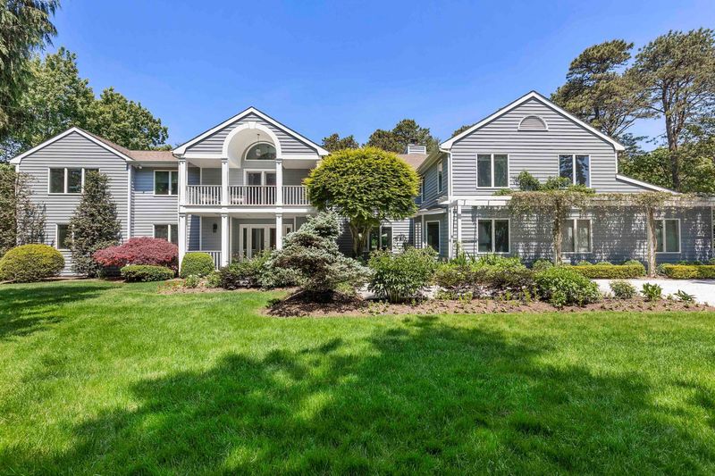 House across the front lawn at 3 Acorn Path, Quogue — photo 2 of 9
