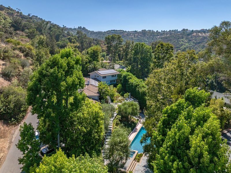 An aerial view of the estate tucked into the green hillsides of Fryman Canyon at 3101 Fryman Road, Studio City — photo 2 of 12