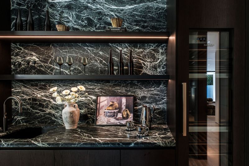 Alpi Verde marble and lit glass shelving off the kitchen at 317 South Wetherly Drive, Beverly Hills — photo 5 of 9