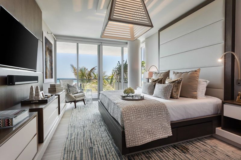 Primary bedroom with ocean-facing glass at Beach House 200, 321 Ocean Drive, Miami Beach — photo 5 of 8
