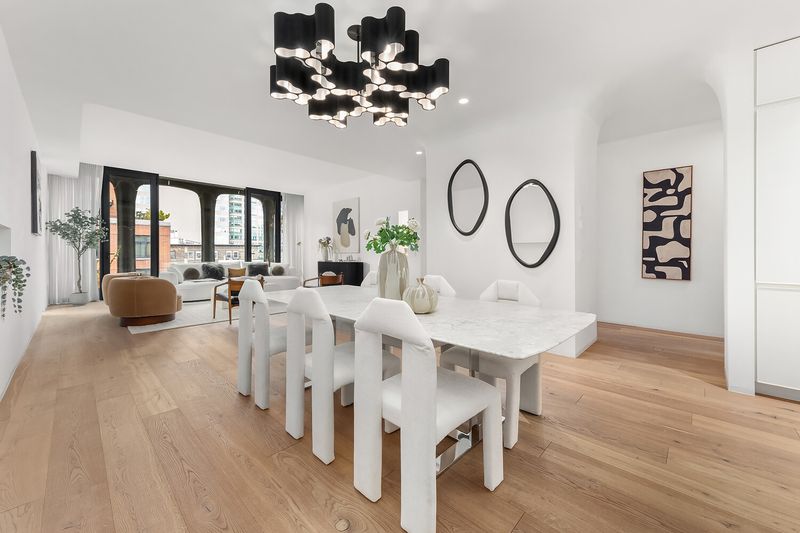 Dining area with living room beyond at 325 West Broadway 7B, SoHo