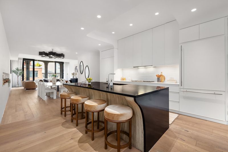 Kitchen with Black Saint Laurent marble island at 325 West Broadway 7B, SoHo — photo 2 of 13