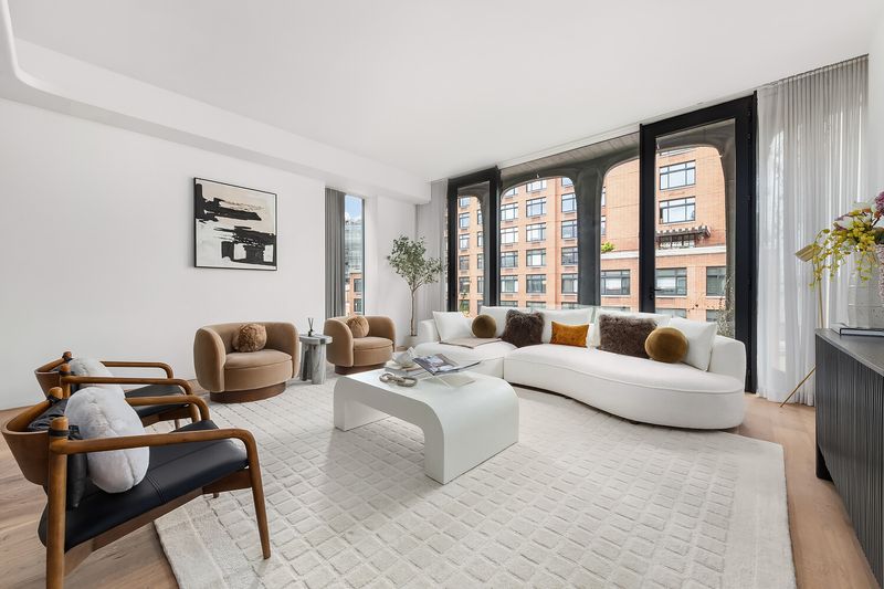 Living room with corner windows at 325 West Broadway 7B, SoHo — photo 3 of 13