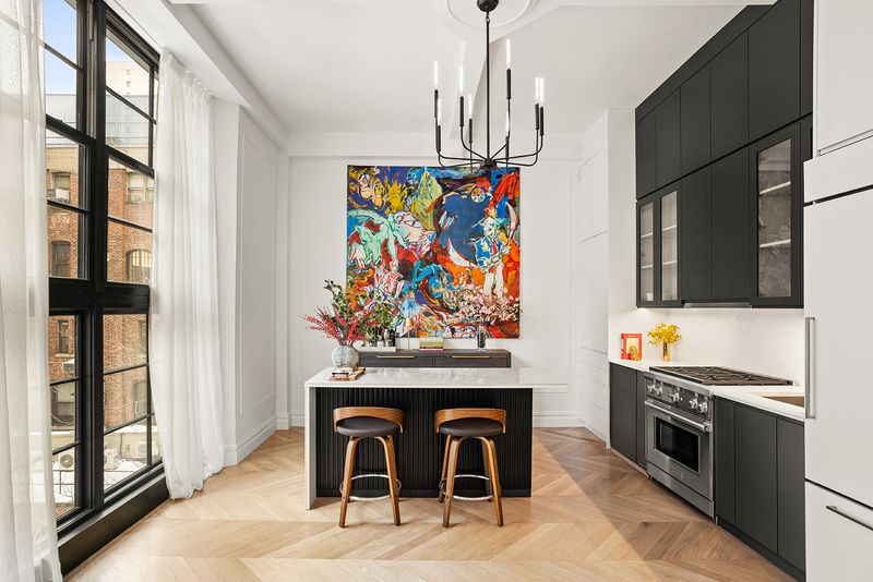Open kitchen with island at The Atelier, 33 West 67th Street 4M, Upper West Side — photo 3 of 8