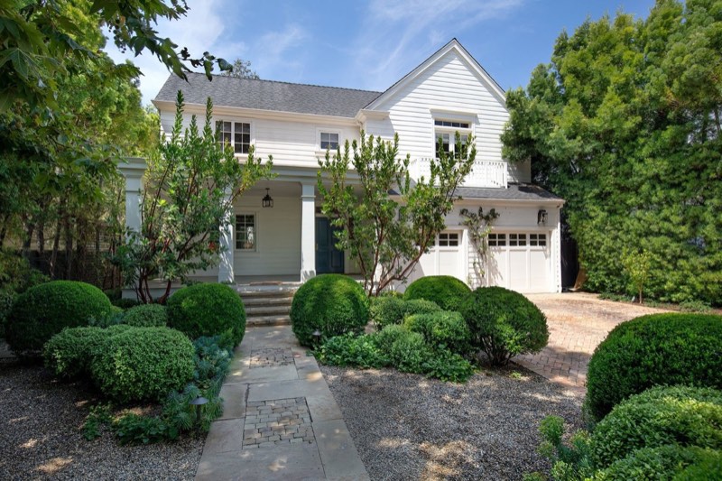 Front elevation with wooden porch at 339 South Carmelina Avenue in the Brentwood flats