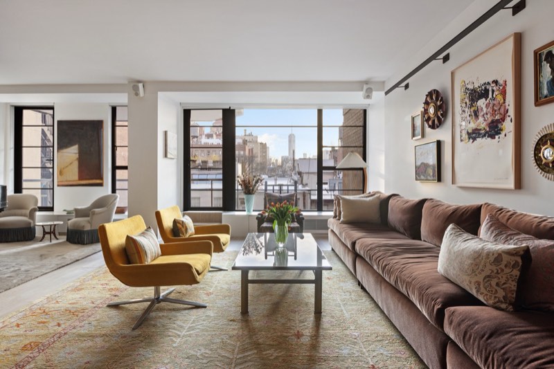 living room, yellow chairs to city windows at 37 West 12th Street 7J