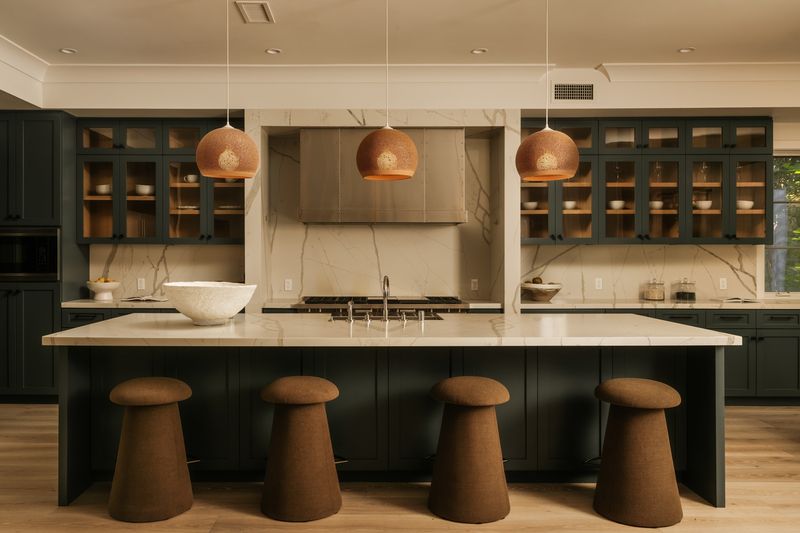 Kitchen with dark green cabinetry and copper pendants at 371 20th Street, Santa Monica — photo 5 of 8