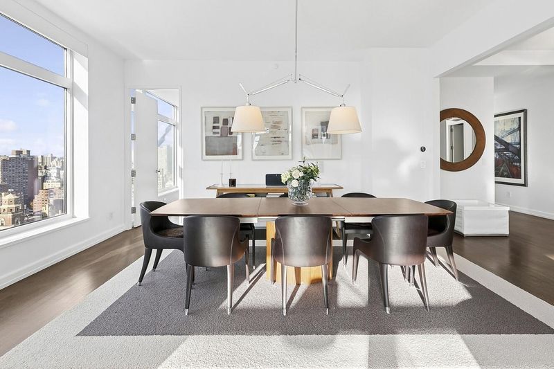 Dining area under twin drum pendants at 400 East 67th Street 27A, Lenox Hill — photo 2 of 8