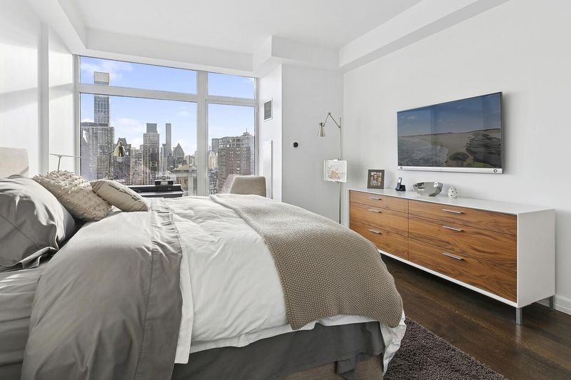 Bedroom with skyline window at 400 East 67th Street 27A, Lenox Hill — photo 5 of 8