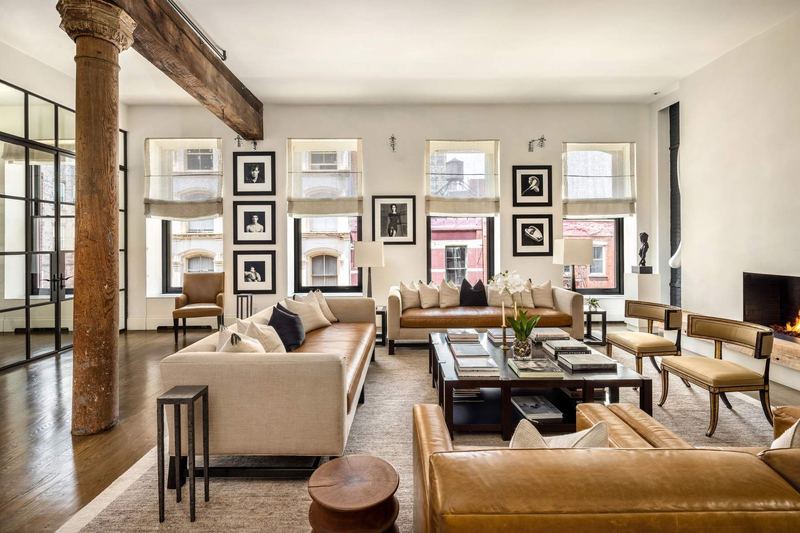 The great room, with original timber beams and cast-iron columns under ceilings of about 12½ feet at 42 Wooster Street #3, SoHo