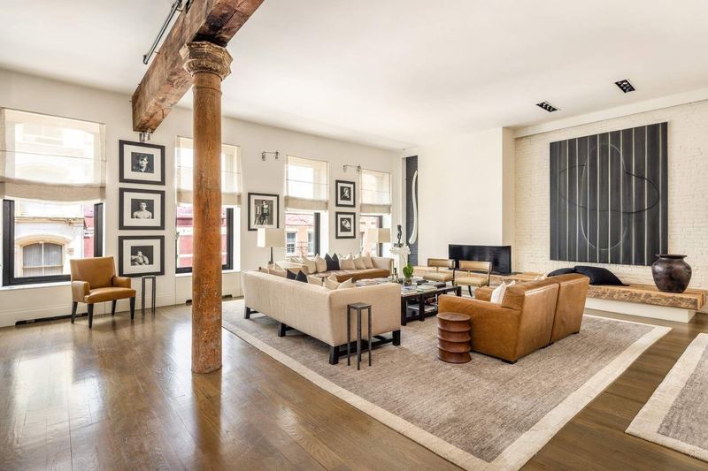 The living area, with gallery-scale walls for art and the gas fireplace at 42 Wooster Street #3, SoHo — photo 2 of 13