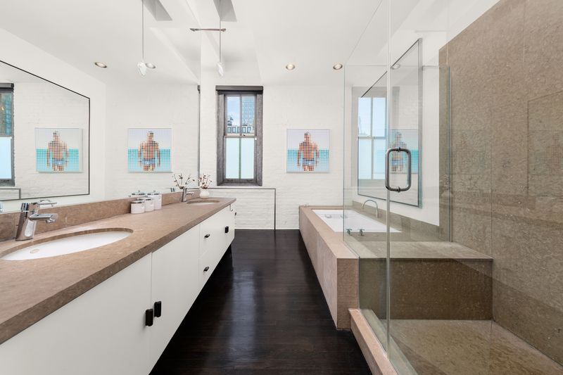 View east to the Empire State Building and the New Yorker sign at The Glass Farmhouse, 448 West 37th Street 11G/12G, Hudson Yards — photo 9 of 10