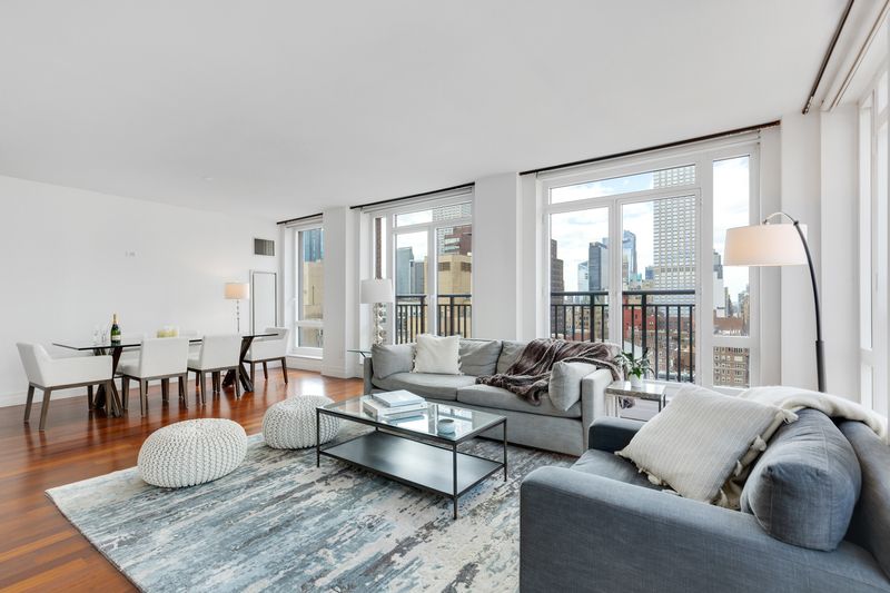 Living room with skyline views at 45 Park Avenue 2101, Murray Hill — photo 2 of 4