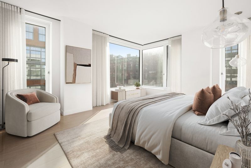 Primary bedroom with corner windows at 450 Washington Street 520, Tribeca — photo 3 of 7