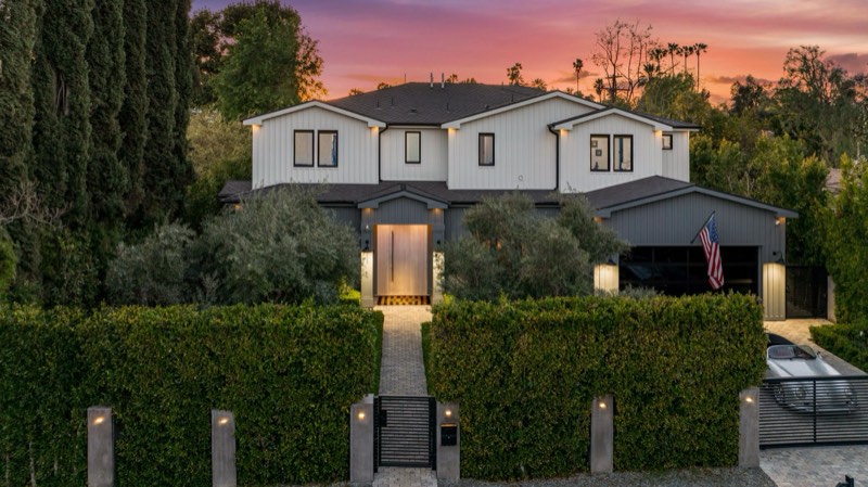 twilight street elevation and hedge gate