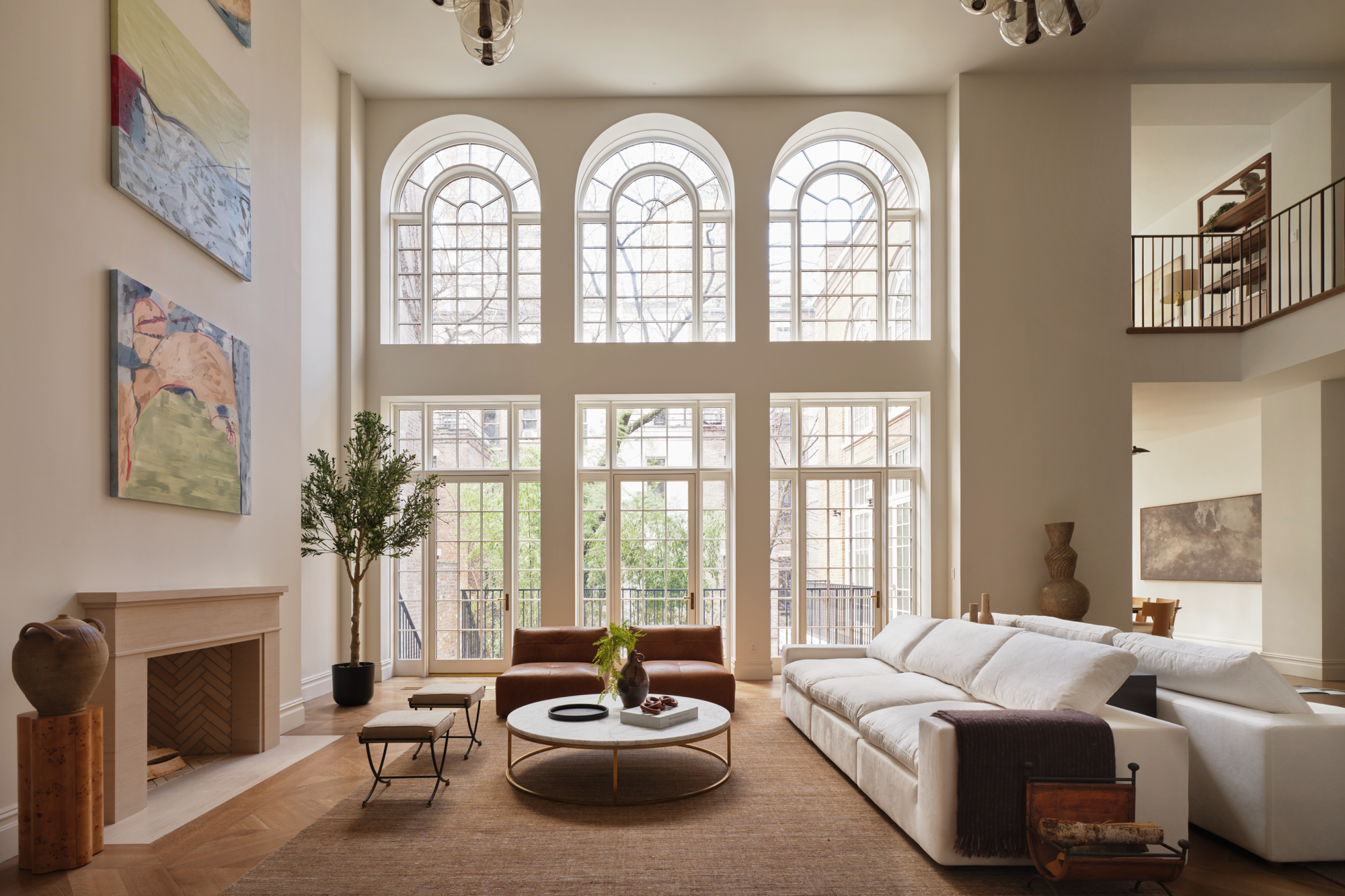 double-height living room at 48–50 West 69th Street