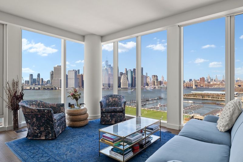Living room with Lower Manhattan skyline views at 50 Bridge Park Drive 16B, Brooklyn Heights — photo 2 of 12