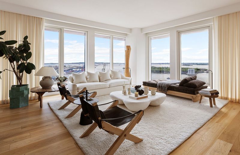 harbor-facing living room at 50 Bridge Park Drive 26A Quay Tower