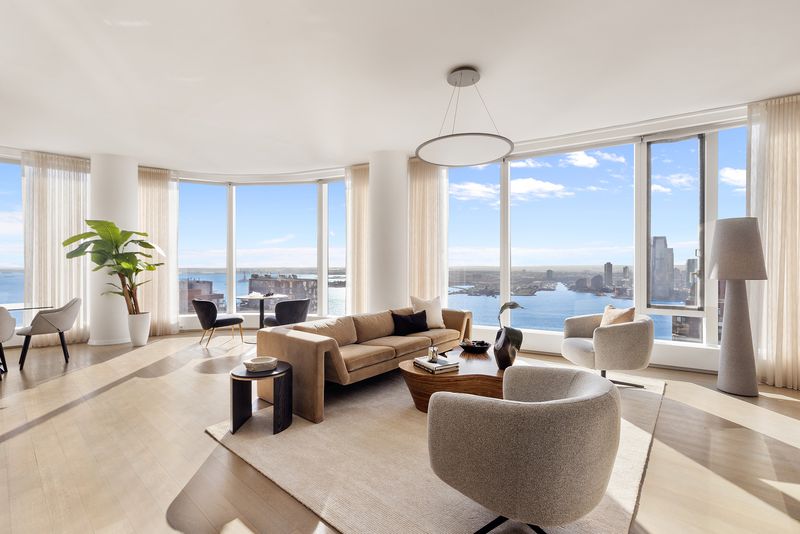 Great room harbor windows at 50 West Street 37C, Financial District