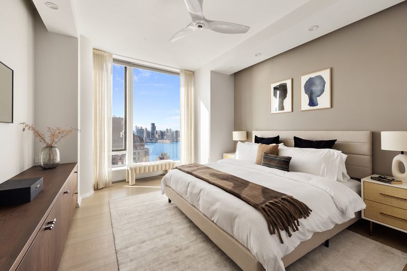 Bedroom skyline window at 50 West Street 37C, Financial District — photo 9 of 9