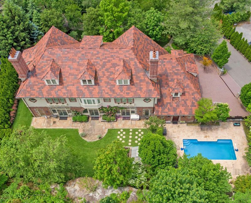 Aerial view of the house, pool and grounds at 5020 Iselin Avenue, Riverdale — photo 3 of 7